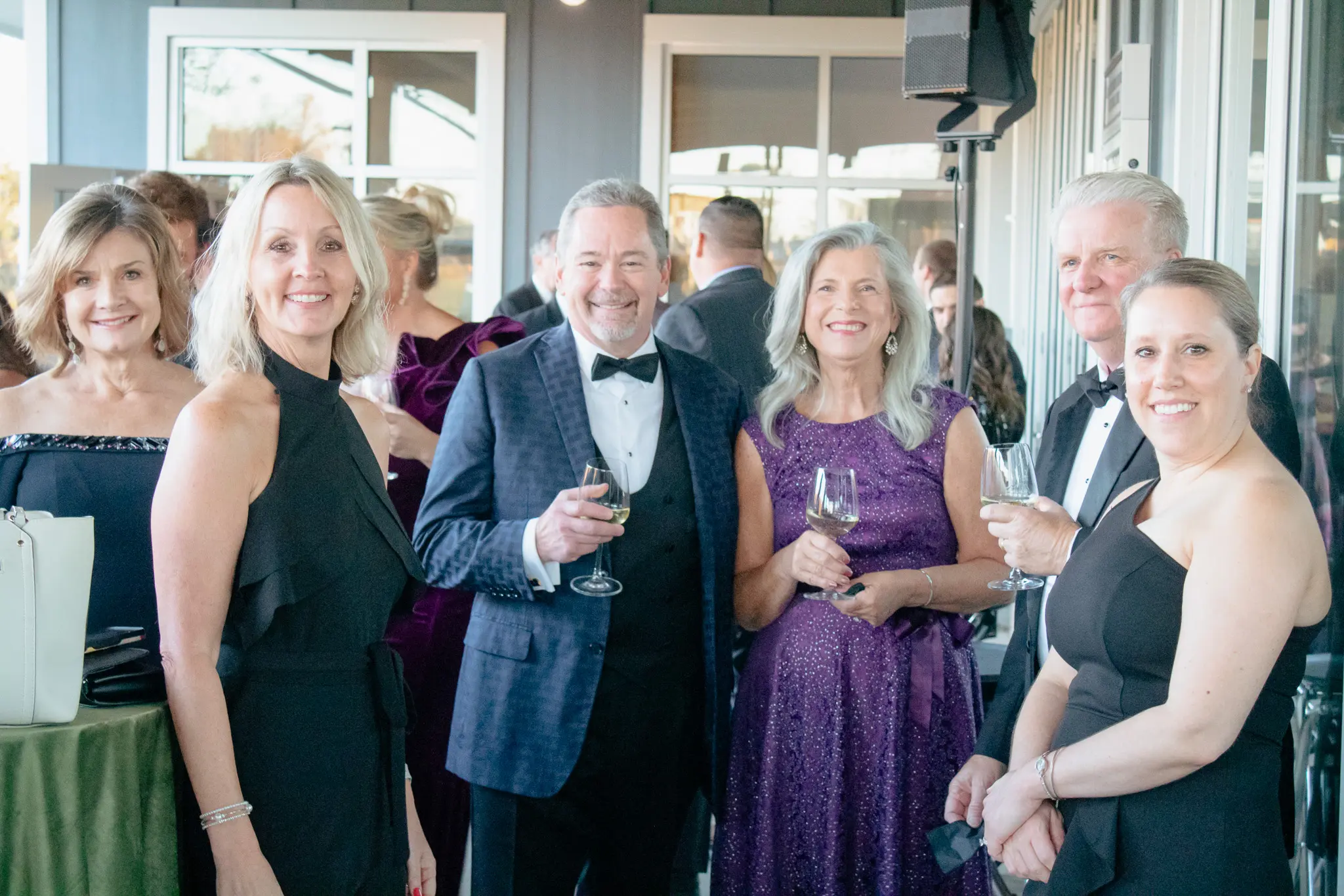 Smiling-guests-in-formal-attire-gathered