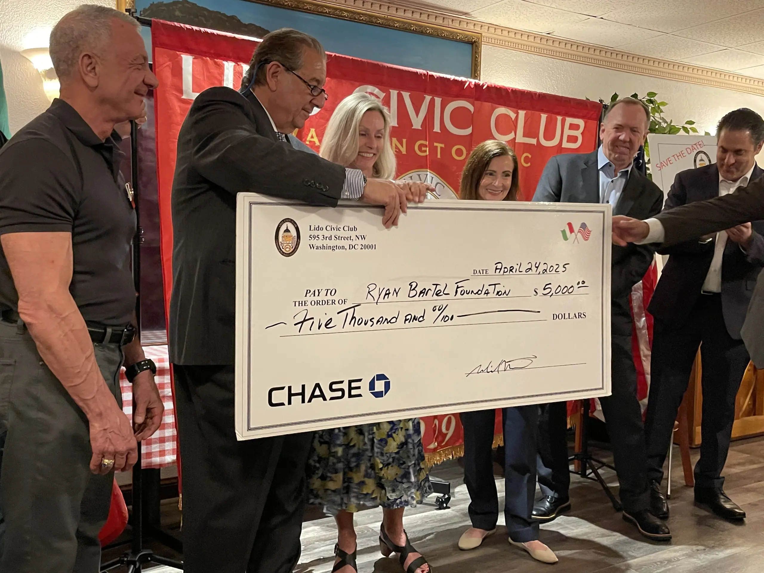 Lido Civic Club members gathered at a community event as corporate partners of the Ryan Bartel Foundation