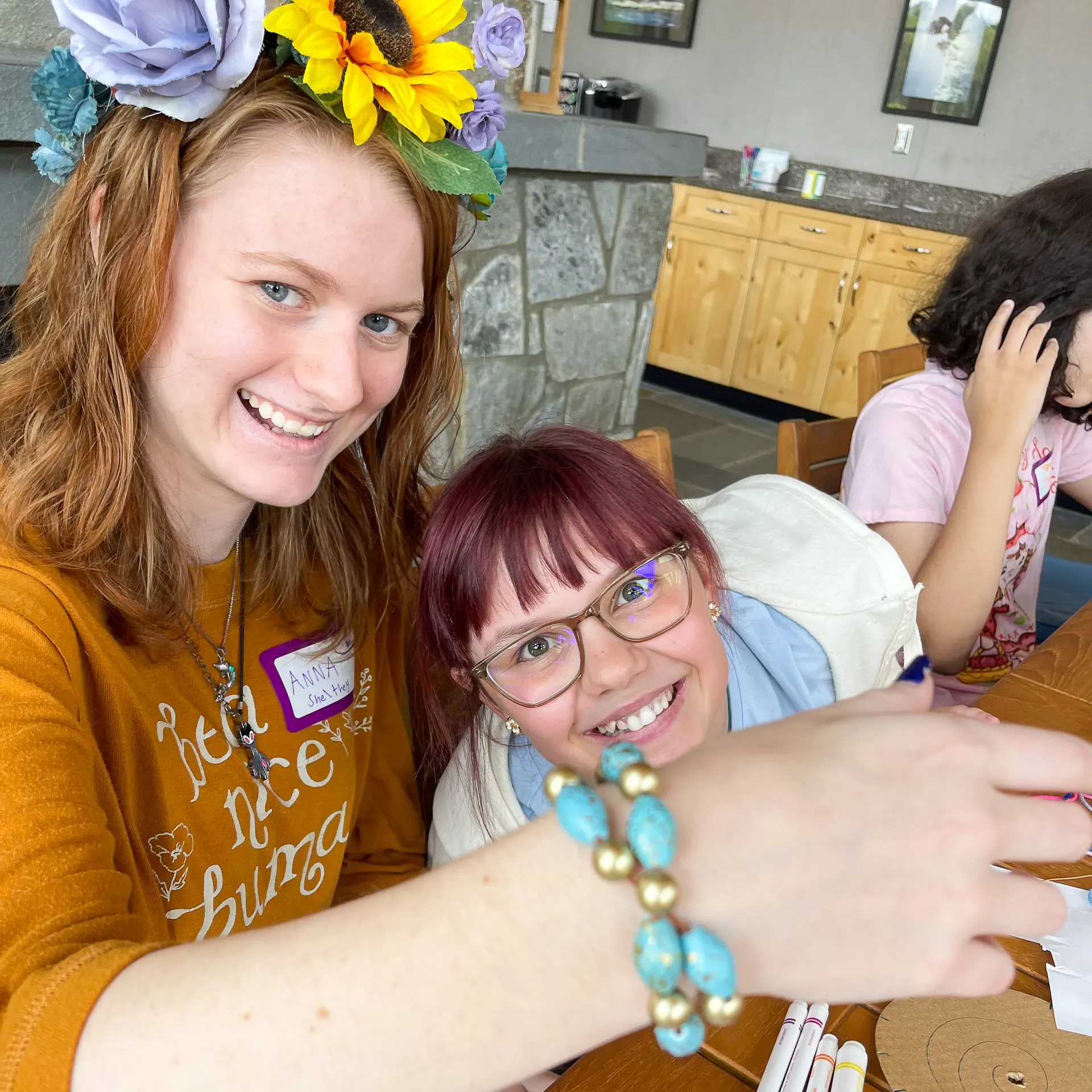 Two young FORT Arts participants smiling together in a portrait